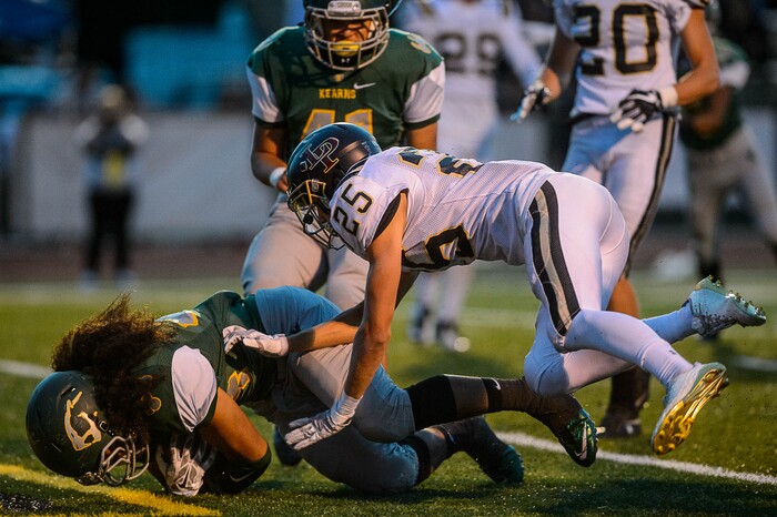 (Trent Nelson | The Salt Lake Tribune) Kearns' Kalux Manuo dives for a touchdown as Kearns hosts Lone Peak, high school football, Thursday September 14, 2017.