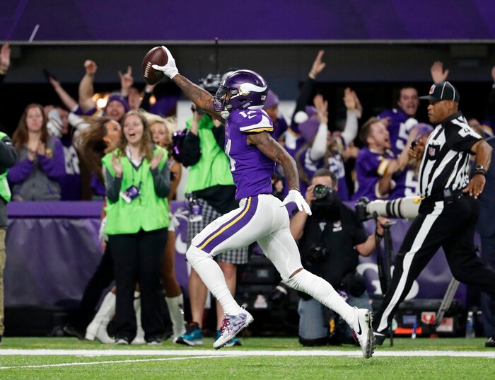 Minnesota Vikings wide receiver Stefon Riggs (14) runs in for a game winning touchdown against the New Orleans Saints during the second half of an NFL divisional football playoff game in Minneapolis, Sunday, Jan. 14, 2018. The Vikings defeated the Saints 29-24. (AP Photo/Jeff Roberson)