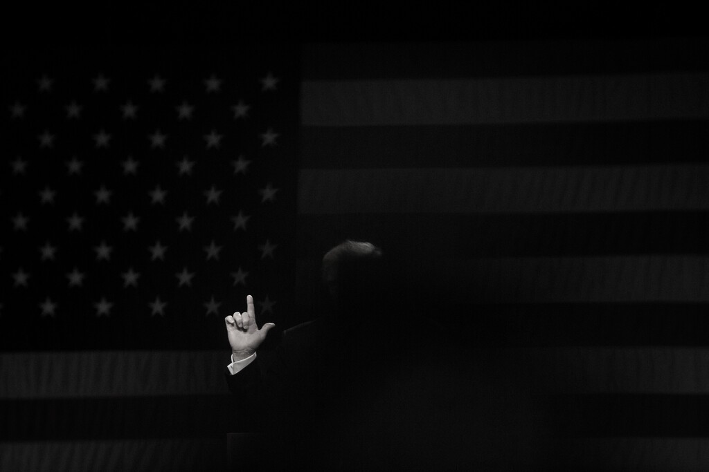 (Damon Winter | The New York Times)

His gesturing hand and a bit of his signature hair are caught by a spotlight as Donald Trump speaks during a campaign rally at the Coliseum Complex in Greensboro, N.C., June 14, 2016. "So when we talk about what’s been lost in the four years of Trump’s administration, we should start with the lost opportunities to address what was revealed in 2016," writes Ross Douthat.
