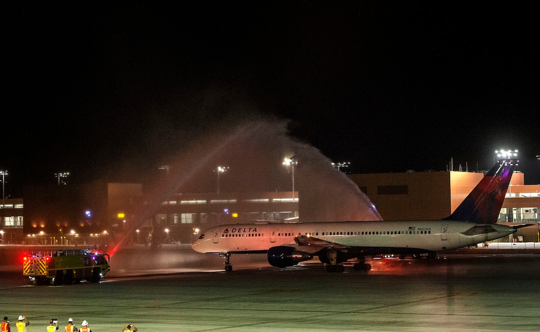 (Rick Egan  |  The Salt Lake Tribune)  Delta flight 2020, the first flight out of the new terminal at the Salt Lake City International Airport goes through a water salute before taking off for Atlanta at 6 a.m. on Tuesday, Sept. 15, 2020.