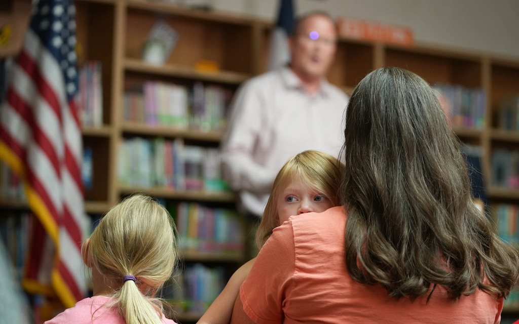 (Francisco Kjolseth | The Salt Lake Tribune) Sharol Stapley, a PTA president, holds her daughter Jane, 3, during a Jordan School District news conference at Columbia Elementary in West Jordan after the district was selected as a lead plaintiff in a national lawsuit suing social media giants including Meta and TikTok on Monday, July 29, 2024.
