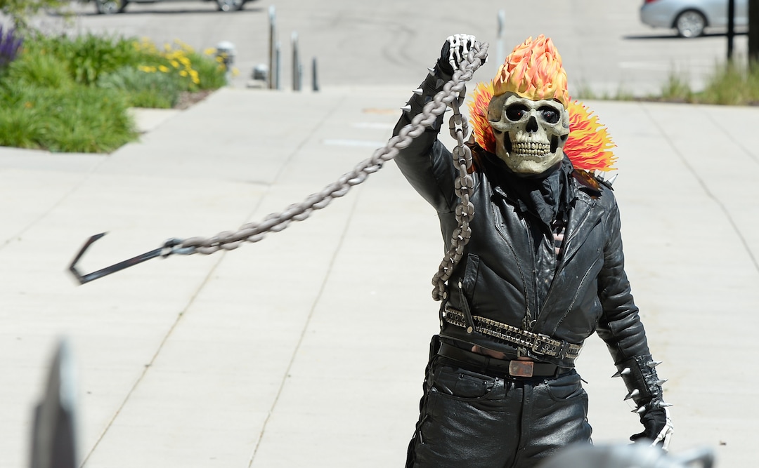 (Francisco Kjolseth  |  The Salt Lake Tribune)  Eric Allan as Ghostrider has a little fun with his costume chain as he joins FanX's twice-annual "press conference," drawing cosplayers to Megaplex Jordan Commons in Sandy on Wed. June 12, 2019, for the announcement of the event's celebrity visitors.