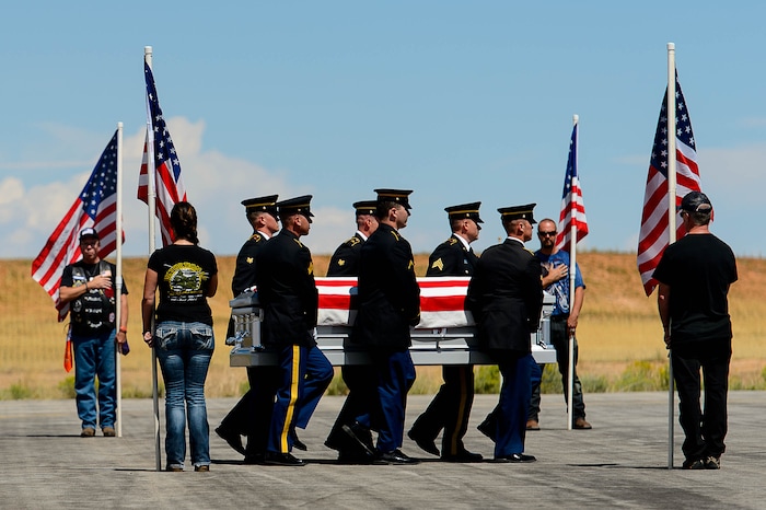 (Trent Nelson | The Salt Lake Tribune)  An honor guard receives the body of fallen soldier Aaron Butler, who was killed last week in Afghanistan, at the Monticello Airport, Thursday August 24, 2017.