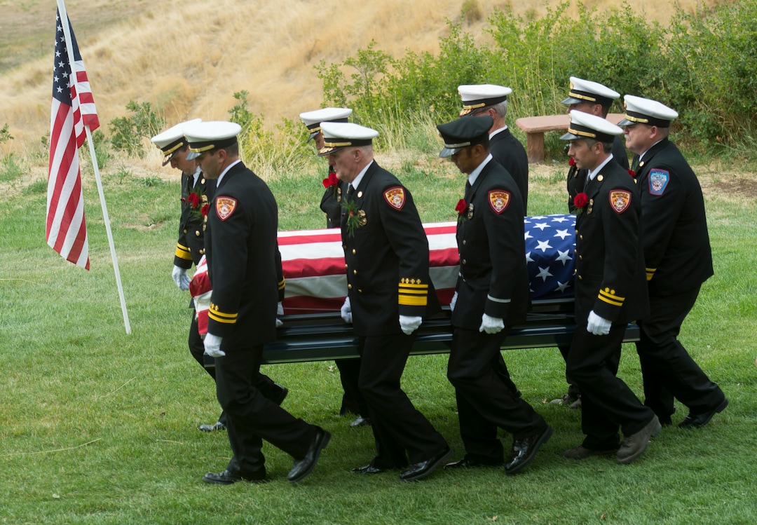 (Rick Egan  |  The Salt Lake Tribune)  The casket carrying Matthew Burchett is carried by the pall bearers at East Lawn Memorial Hills Cemetery in Provo, Monday, Aug. 20, 2018.