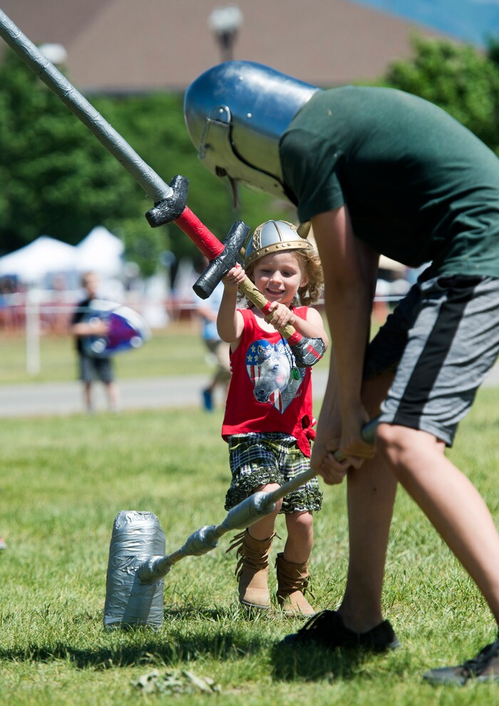 (Rick Egan  |  The Salt Lake Tribune)      Graeme Blysma, 4, from Midvale, fights a knight at the 44th annual Utah Scottish Festival and Highland Games at the Utah State Fairgrounds, Sunday, June 10, 2018.