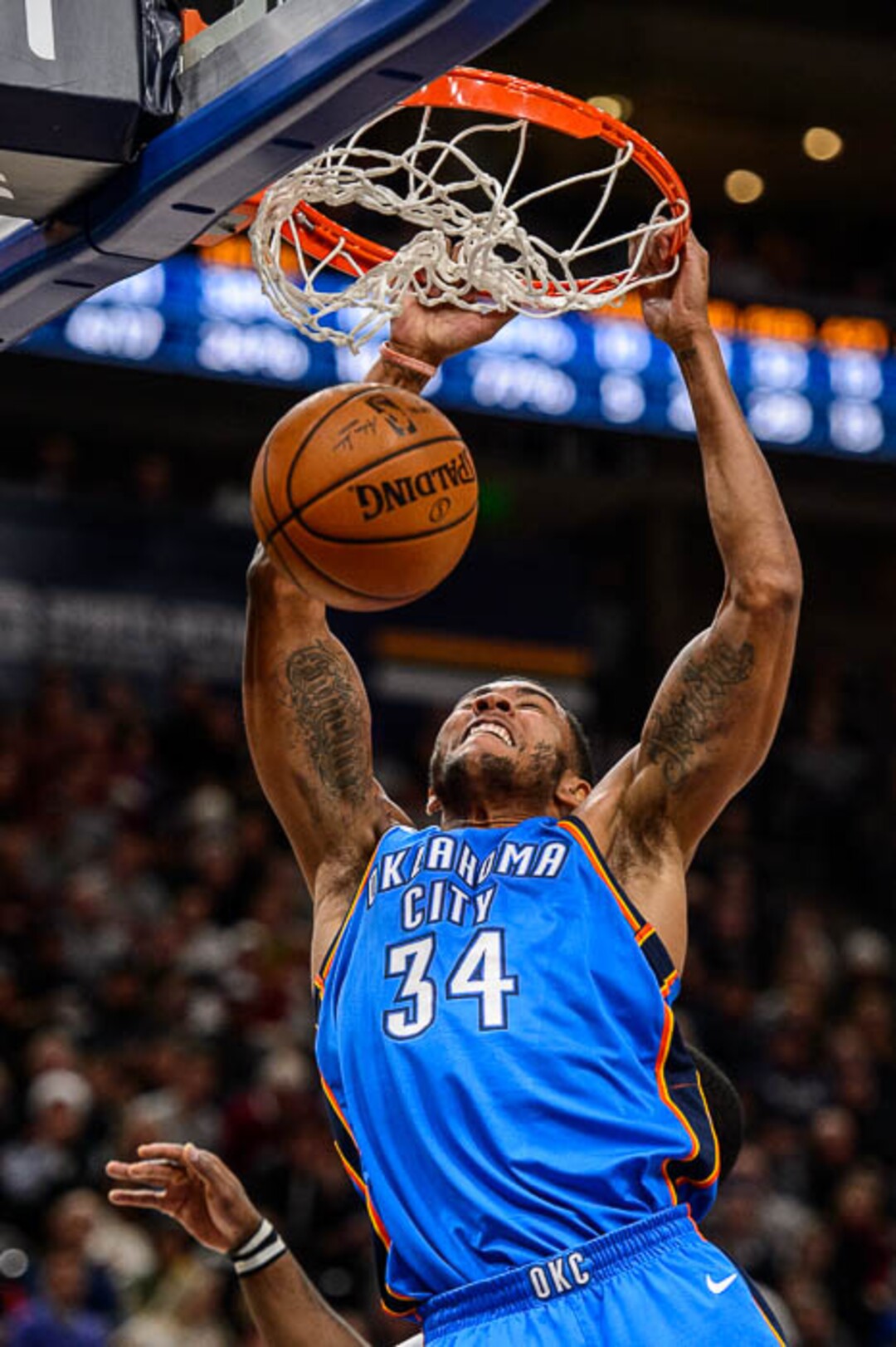 (Trent Nelson | The Salt Lake Tribune)  Oklahoma City Thunder forward Josh Huestis (34) dunks the ball as the Utah Jazz host the Oklahoma City Thunder, NBA basketball in Salt Lake City, Saturday December 23, 2017.