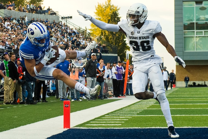 (Chris Detrick  |  The Salt Lake Tribune)  Brigham Young Cougars wide receiver Beau Tanner (33) makes a touchdown catch past Utah State Aggies cornerback Ja'Marcus Ingram (36) during the game at Merlin Olsen Field at Maverik Stadium Friday, September 29, 2017.