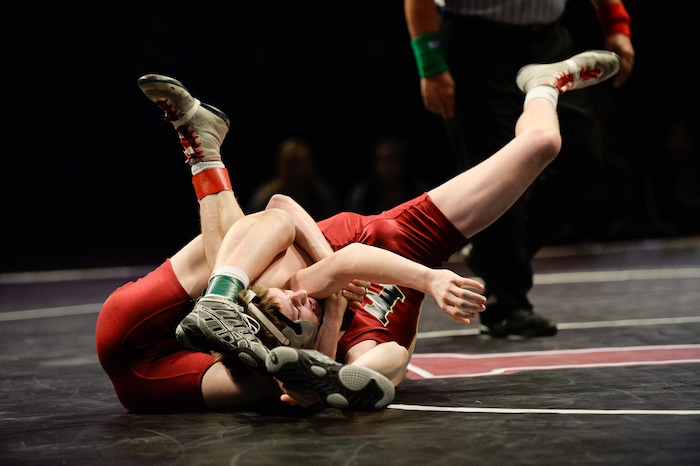 (Francisco Kjolseth  |  The Salt Lake Tribune)  River Wardle and Gage Ogden, both of Herriman, battle it out in the 6A 106 weight class during the state wrestling championship match at the Utah Valley University UCCU Center on Thursday, Feb. 8, 2018.