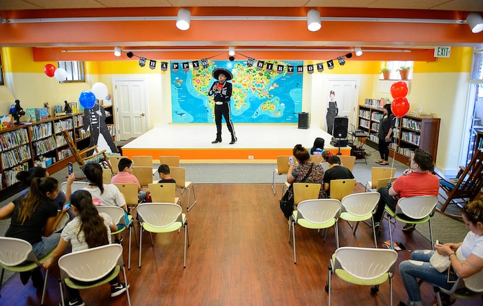 (Trent Nelson | The Salt Lake Tribune)  Singer Jorge Luis Galez performs at Chapman Branch Library Centennial Day, a celebration of the Chapman Branch Library's 100th birthday, in Salt Lake City, Saturday June 2, 2018.