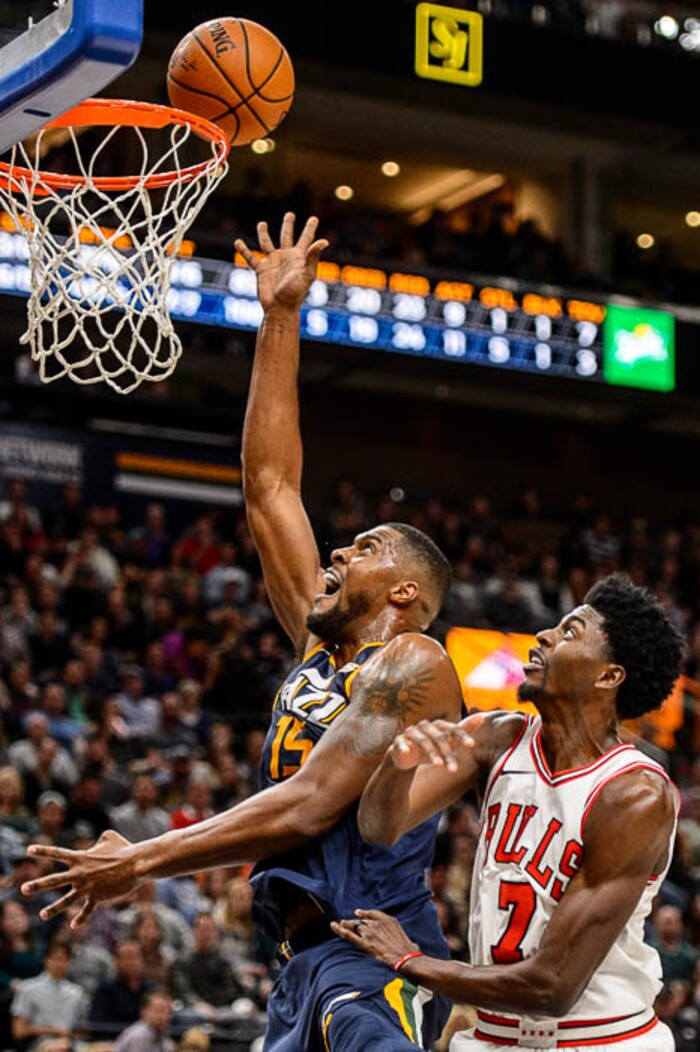(Trent Nelson | The Salt Lake Tribune)  Utah Jazz forward Derrick Favors (15) and Chicago Bulls guard Justin Holiday (7) as the Utah Jazz host the Chicago Bulls, NBA basketball in Salt Lake City Wednesday November 22, 2017.