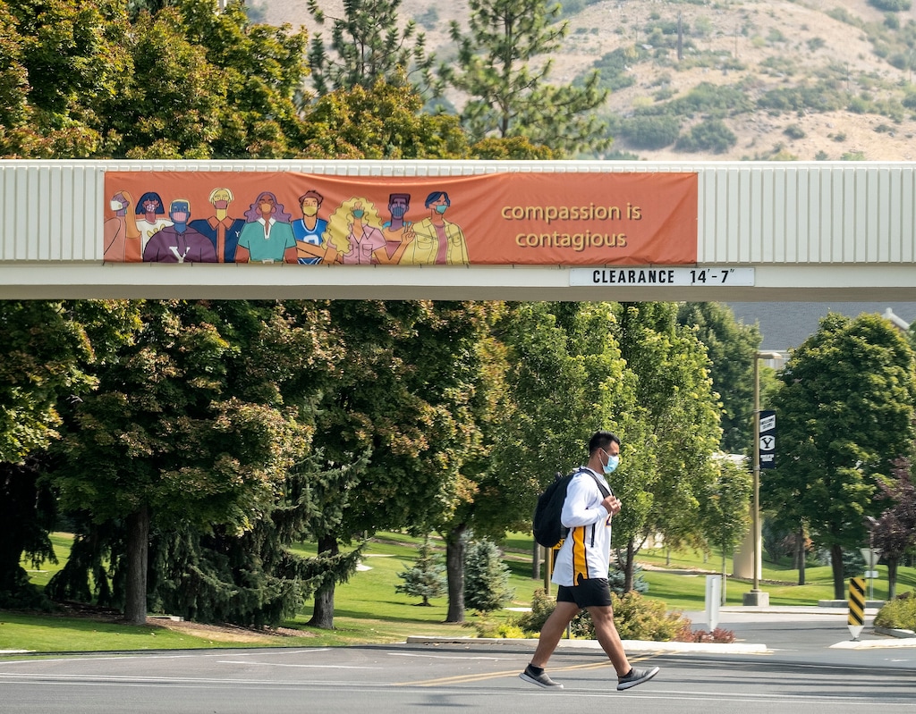 (Leah Hogsten | The Salt Lake Tribune) A Brigham Young University student walks on campus on Sept. 16, 2020. The school announced that masks will be required for the 2021-2022 school year.