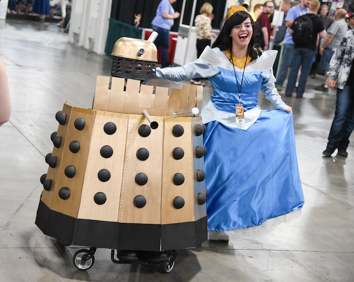 (Francisco Kjolseth  |  The Salt Lake Tribune)  Chelsea Grimes as princess Aurora poses for a photograph with Jason White as Dalek from Dr. Who as they attend the start of FanX Salt Lake Comic Convention at the Salt Palace in Salt Lake City Thursday, Sept. 6, 2018, during the three-day pop culture convention.