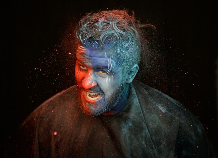 (Francisco Kjolseth | The Salt Lake Tribune) BYU and Utah fan alike Brad Klekas of South Jordan shows his mutual admiration by stepping into the Tribune studio to get both colors in anticipation of the upcoming match up between the two rival teams on Saturday.