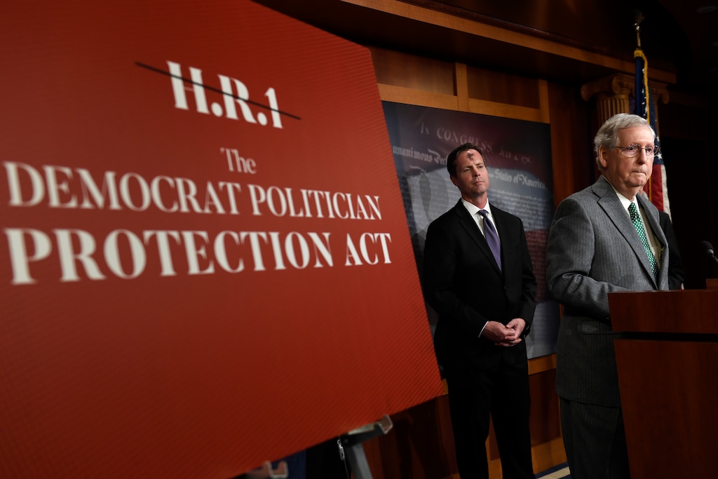 Senate Majority Leader Mitch McConnell of Ky., right, speaks during a news conference on Capitol Hill in Washington, Wednesday, March 6, 2019. McConnell is opposed to H.R. 1, the first bill of the new House majority that tackles campaign finance reforms and other issues. Rep. Rodney Davis, R-Ill., listens at left. (AP Photo/Susan Walsh)