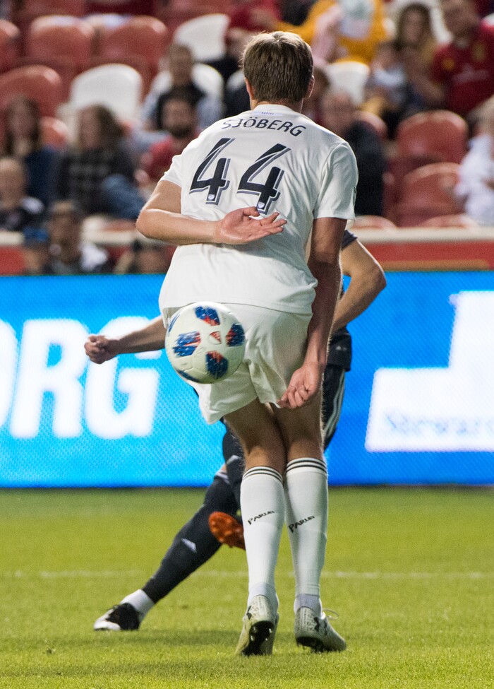 (Rick Egan  |  The Salt Lake Tribune) Real midfielder Damir Kreilach (6) bends the ball around defender Colorado Rapids defender Axel Sjoberg (44) for a Salt Lake goal, in MLS soccer action, between Real Salt Lake and Colorado Rapids,  at Rio Tinto Stadium, Saturday, April 21, 2018.


