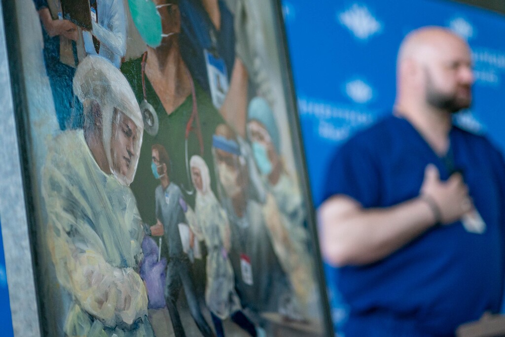 (Francisco Kjolseth | Salt Lake Tribune file photo) Intermountain Healthcare emergency department nurse Jay Larsen talks about a challenging year and working with a team of dedicated colleagues during an unveiling of new artwork by Utah artist Heather Olsen, that pays tribute to frontline health care workers during the COVID-19 pandemic, Monday, April 5, 2021, in Murray.
