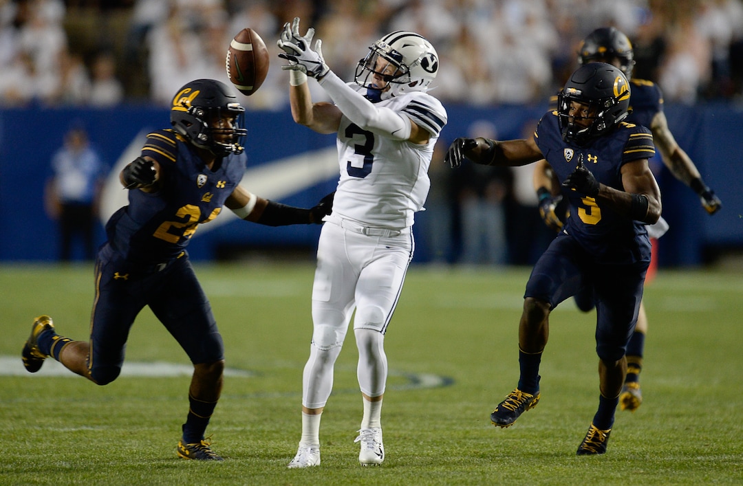 (Francisco Kjolseth  |  The Salt Lake Tribune)  Brigham Young Cougars wide receiver Dylan Collie (3) comes close to receiving a long pass as California Golden Bears cornerback Camryn Bynum (24) and California Golden Bears quarterback Ross Bowers (3) barrels in during the first half of the NCAA college football game, Saturday, Sept. 8, 2018, at LaVell Edwards stadium in Provo, Utah.