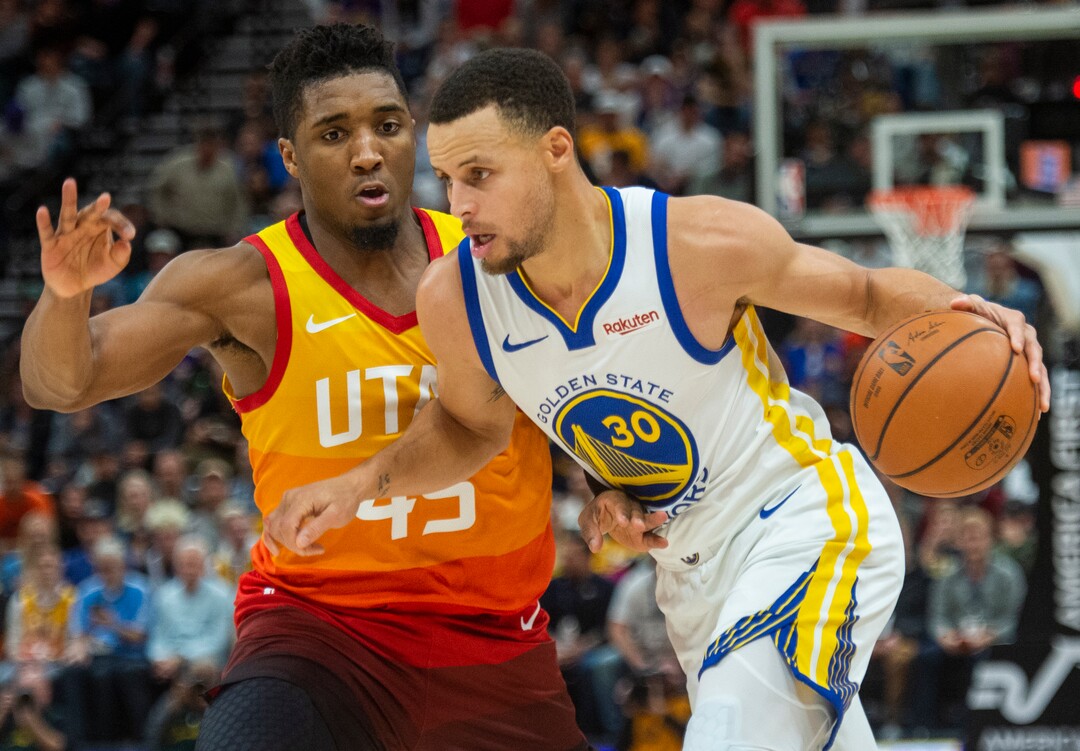 (Rick Egan  |  The Salt Lake Tribune)    Golden State Warriors guard Stephen Curry (30) takes the ball down the lane, as Utah Jazz guard Donovan Mitchell (45) defends, in NBA action between Utah Jazz and Golden State Warriors, in Salt Lake City, Wednesday, Dec. 19, 2018.