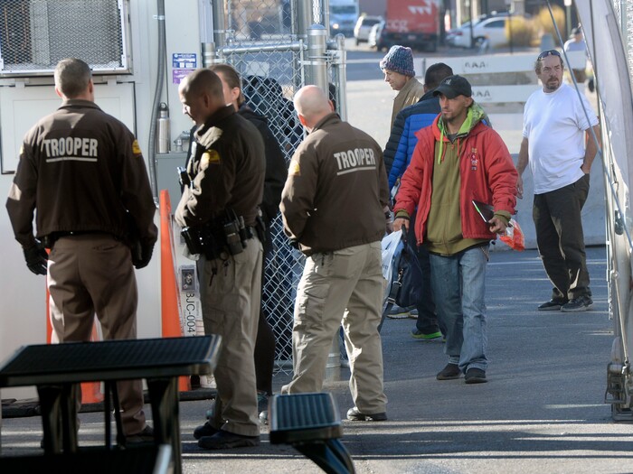 (Al Hartmann | The Salt Lake Tribune)
Starting Friday Oct. 27 homeless check in at booth at left to have their coordinated services card scanned before passing into the "safe space" courtyard outside the Road Home shelter. Security provided by the Utah Highway Patrol. The area is accessible from the south on Rio Grand Street. The area to the north at 200 South and Rio Grand is fenced and locked.