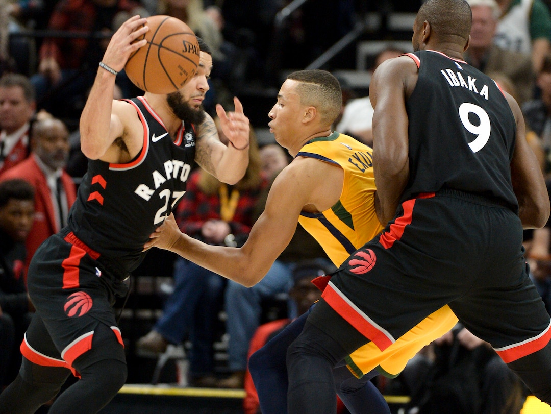 Leah Hogsten  |  The Salt Lake Tribune  Utah Jazz guard Dante Exum (11) is blocked by Toronto Raptors forward Serge Ibaka (9) trying to stay with Toronto Raptors forward Chris Boucher (25) as the Utah Jazz host the Toronto Raptors, Monday, Nov. 5, 2018 at Vivint Smart Home Arena.