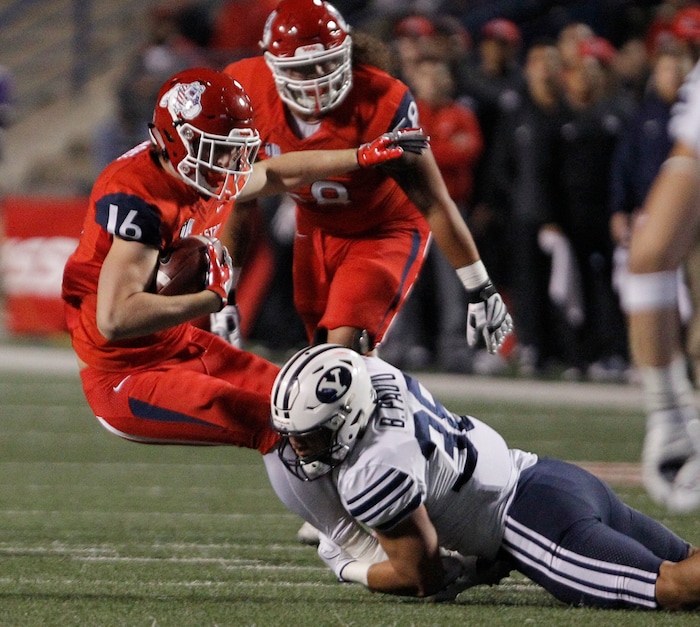 BYU's Butch Pau'u tackles Fresno State's Jared Rice during the first half of an NCAA college football game in Fresno, Calif., Saturday, Nov. 4, 2017. (AP Photo/Gary Kazanjian)