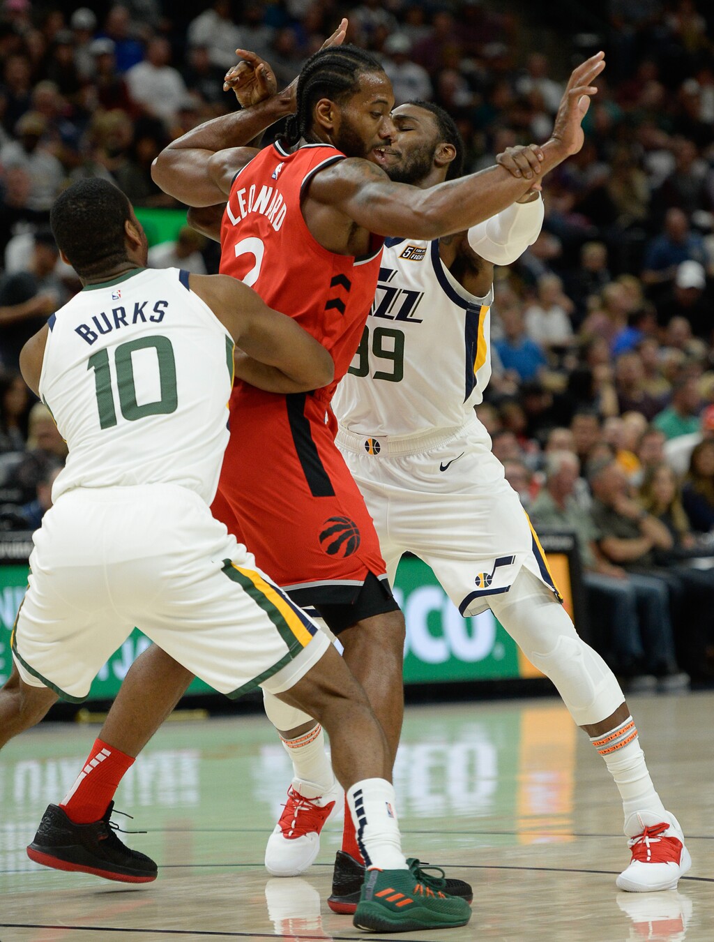 (Francisco Kjolseth | The Salt Lake Tribune) Toronto Raptors forward Kawhi Leonard (2), center, is defended by Utah Jazz guard Alec Burks (10) and Utah Jazz forward Jae Crowder (99) in the first half of the preseason NBA game at Vivint Smart Home Arena Tuesday, Oct. 2, 2018, in Salt Lake City.