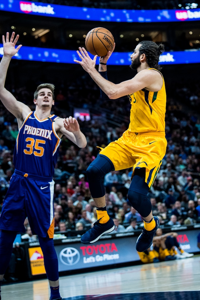 (Chris Detrick  |  The Salt Lake Tribune)  Utah Jazz guard Ricky Rubio (3) shoots past Phoenix Suns forward Dragan Bender (35) during the game at Vivint Smart Home Arena Thursday, March 15, 2018. Utah Jazz defeated Phoenix Suns 116-88.