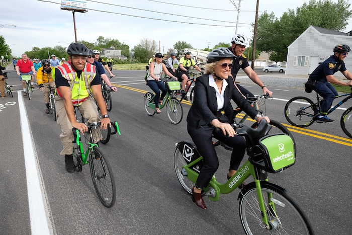 (Francisco Kjolseth | The Salt Lake Tribune) Salt Lake City Mayor Jackie Biskupski, center back, is joined by Police Chief Mike Brown, members of the public and city employees on Thursday, May 16, 2019, as part of the annual MayorÕs Bike to Work Day. This yearÕs ride began at the Northwest Recreation Center and ran primarily along the Jordan River Trail in an effort to show off the investments the city and others have made to the trail.