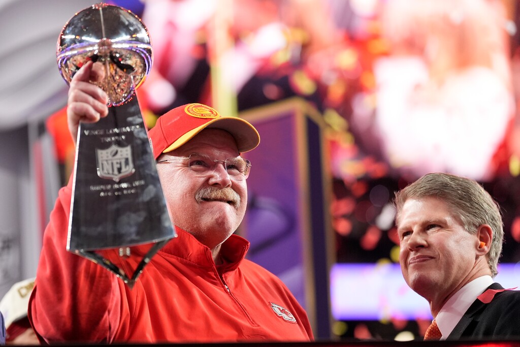 (Ashley Landis | AP) Kansas City Chiefs head coach Andy Reid holds the Vince Lombardi Trophy as Kansas City Chiefs chairman and CEO Clark Hunt looks on after the NFL Super Bowl 58 football game against the San Francisco 49ers on Sunday, Feb. 11, 2024, in Las Vegas. The Chiefs won 25-22.