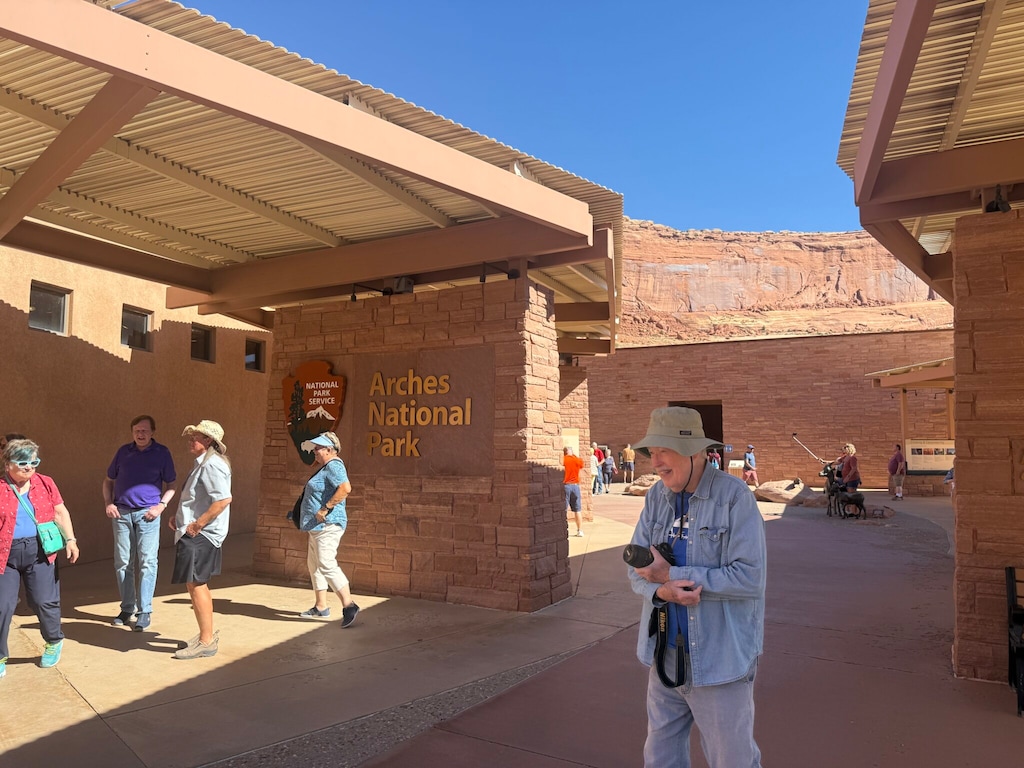 (Lizzie Ramirez | The Times-Independent) Visitors at Arches National Park wander outside of the closed visitors center on Thursday, Oct. 2.