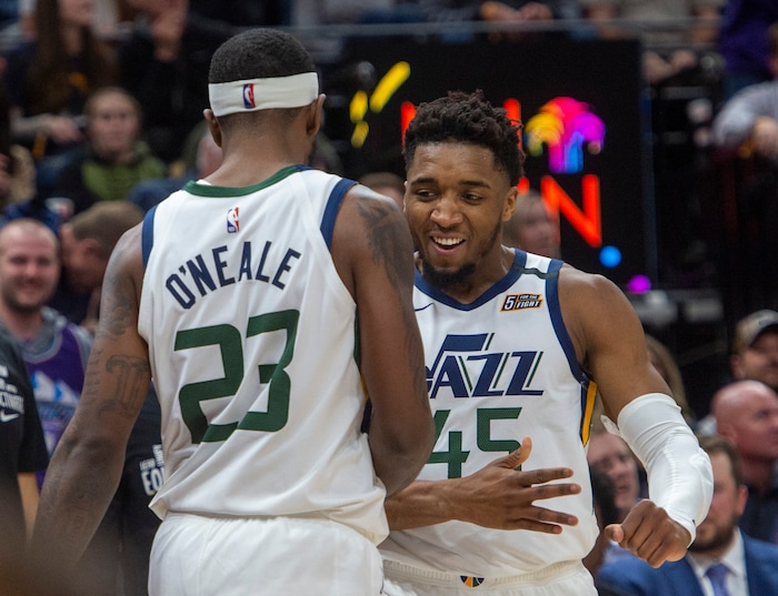 (Rick Egan  |  The Salt Lake Tribune) Utah Jazz guard Donovan Mitchell (45) celebrates after Utah Jazz forward Royce O'Neale (23)stole an inbound pass and was found as he went to the hoop, in NBA action between the Utah Jazz and the Washington Wizards, in Salt Lake City, Friday, February 28, 2020