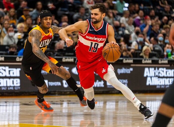 (Rick Egan | The Salt Lake Tribune) Washington Wizards guard Raul Neto (19) gets past Utah Jazz guard Jordan Clarkson (00), in NBA action between the Utah Jazz and the Washington Wizards, at Vivint Arena on Saturday, Dec. 18, 2021.