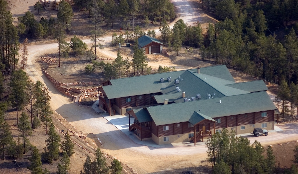 (Mike Stewart | The Associated Press) In this April 22, 2008 aerial file photo, buildings are seen on the Fundamentalist Church of Jesus Christ of Latter Day Saints' compound that has nearly 50,000 square feet of residential space near Pringle, in the Black Hills region of South Dakota. A South Dakota legislative panel has approved imposing a criminal penalty for failing to report births and deaths based on concerns about the polygamous group's outpost in the Black Hills. State law requires births and deaths to be reported, but the Department of Health said in 2017 that no such records had been filed from the compound's address in the previous 10 years. One former resident said births occurred at the site, including two of her own children.