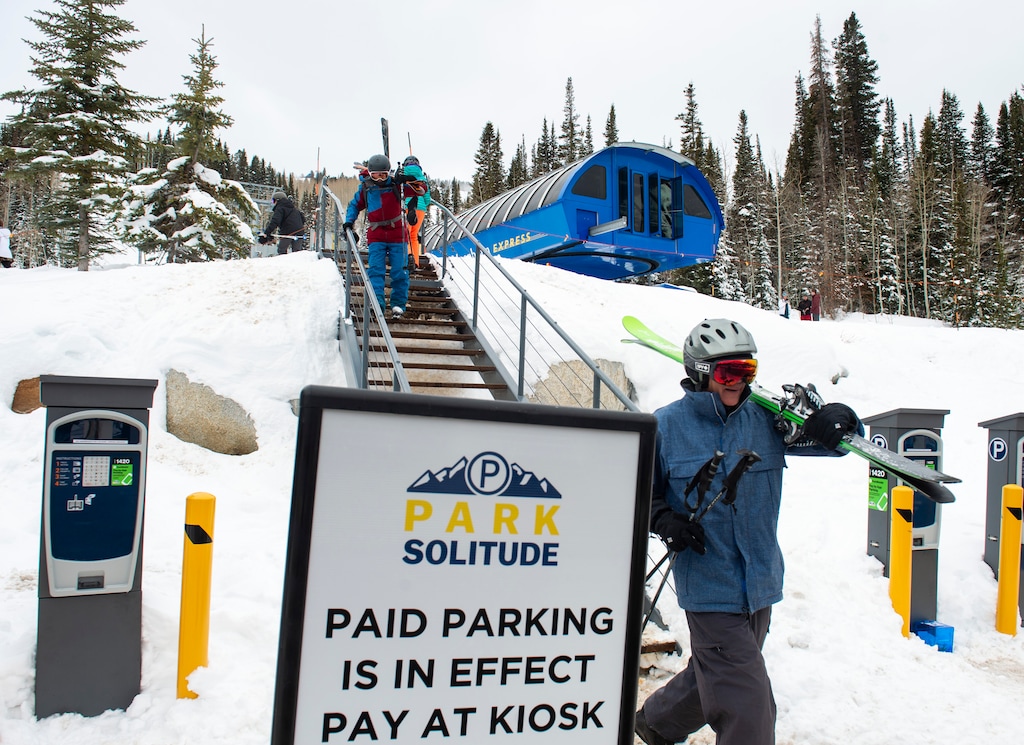 (Rick Egan | The Salt Lake Tribune) Skiers walk from the mountain to the parking lot at Solitude Mountain Resort, Wednesday, Dec. 11, 2019. Solitude implemented a paid parking lot at the beginning of this ski season.