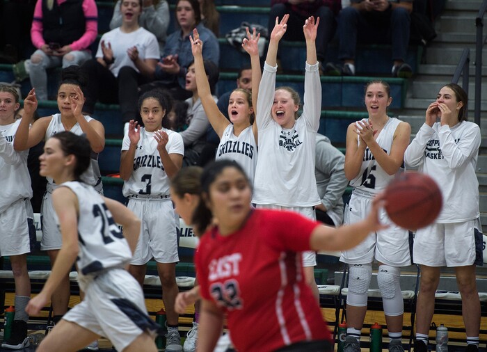 (Scott Sommerdorf | The Salt Lake Tribune)
The Copper Hills bench celebrates one of three consecutive 3-point shots during second half play as Copper Hills defeated East 82-62, Friday, December 29, 2017.