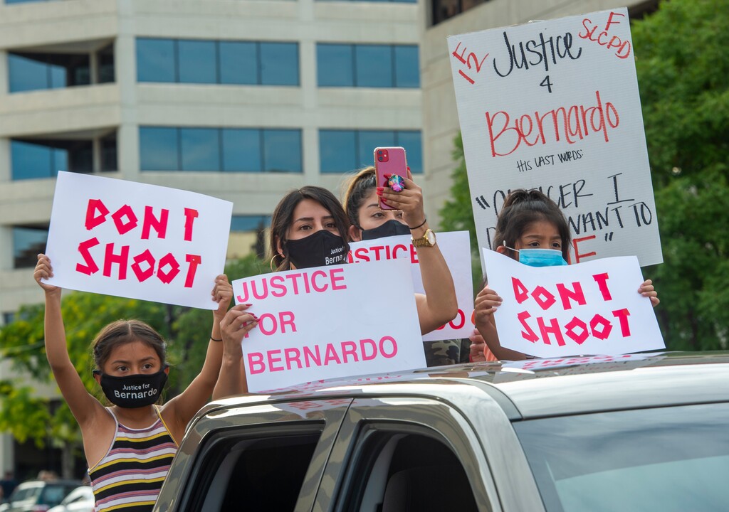 (Rick Egan  |  The Salt Lake Tribune)     Relatives of Berardo Palacios hold signs as they follow the marchers, during a demonstration in Salt Lake City on Saturday, June 20, 2020.
