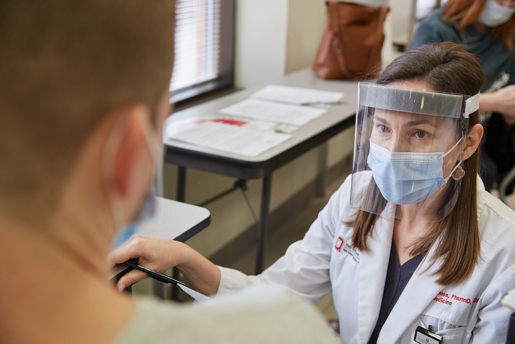 (Brian Kaiser for The New York Times)

Emily Vrontos, a pharmacist, reviews a patient’s medical history before administering a COVID-19 vaccine.