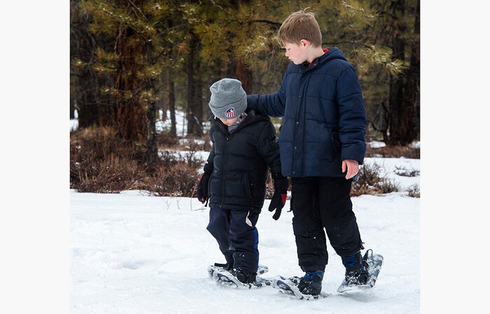 (Rick Egan | The Salt Lake Tribune) Conor Holmberg,10 walks with his 4-year-old little brother Griffin, during a snowshoe tour of the Dixie National Forest, during the 36th annual Ruby's Inn Bryce Canyon Winter Festival on Saturday, Feb. 13, 2021.
