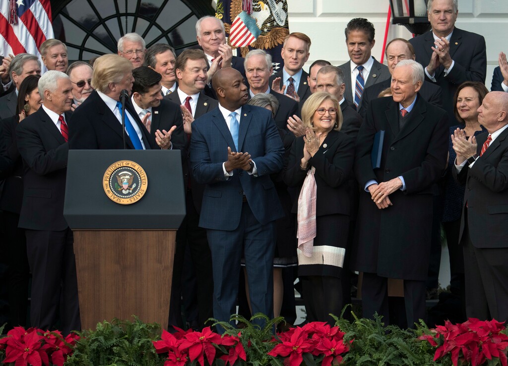 President Donald Trump acknowledges Sen. Orrin Hatch, R-Utah., as he speaks during an event on the South Lawn of the White House in Washington, Wednesday, Dec. 20, 2017, to acknowledge the final passage of tax overhaul legislation by Congress. (AP Photo/Carolyn Kaster)