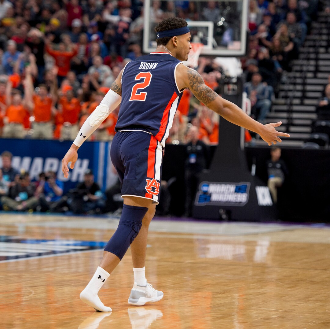 (Leah Hogsten  | The Salt Lake Tribune)  Auburn Tigers guard Bryce Brown (2) looks for his missing shoe as Auburn faces Kansas in the second round of the NCAA tournament in Salt Lake City on Saturday, March 23, 2019.