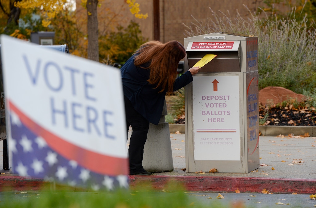 (Chris Samuels | The Salt Lake Tribune) A voter submits a ballot at the Salt Lake County Government Center, Tuesday, Nov. 2, 2021.