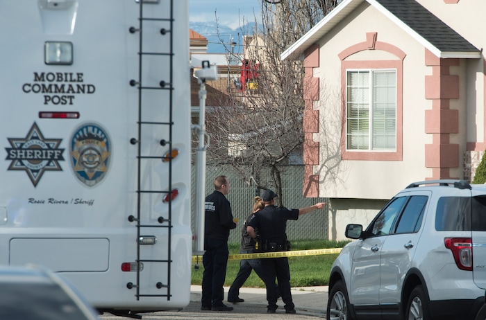 (Rick Egan | The Salt Lake Tribune) Investigators from West Valley and Unified Police investigate an officer involved shooting, leaving the suspect dead, in West Valley City, Sunday, April 8, 2018.