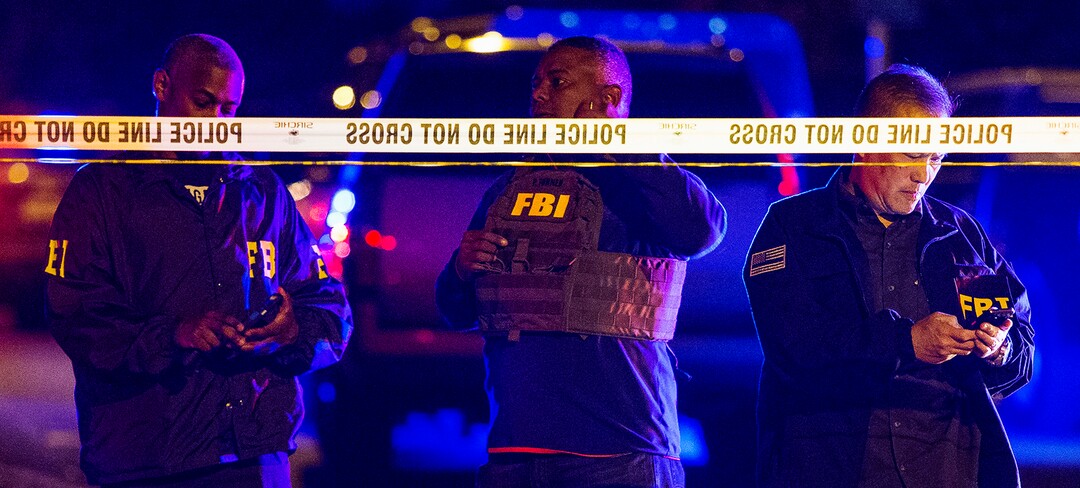 FBI agents work the scene of an explosion in Austin, Texas, Sunday, March 18, 2018. At least a few people were injured in another explosion in Texas' capital late Sunday, after three package bombs detonated this month in other parts of the city, killing two people and injuring two others. (Nick Wagner/Austin American-Statesman via AP)