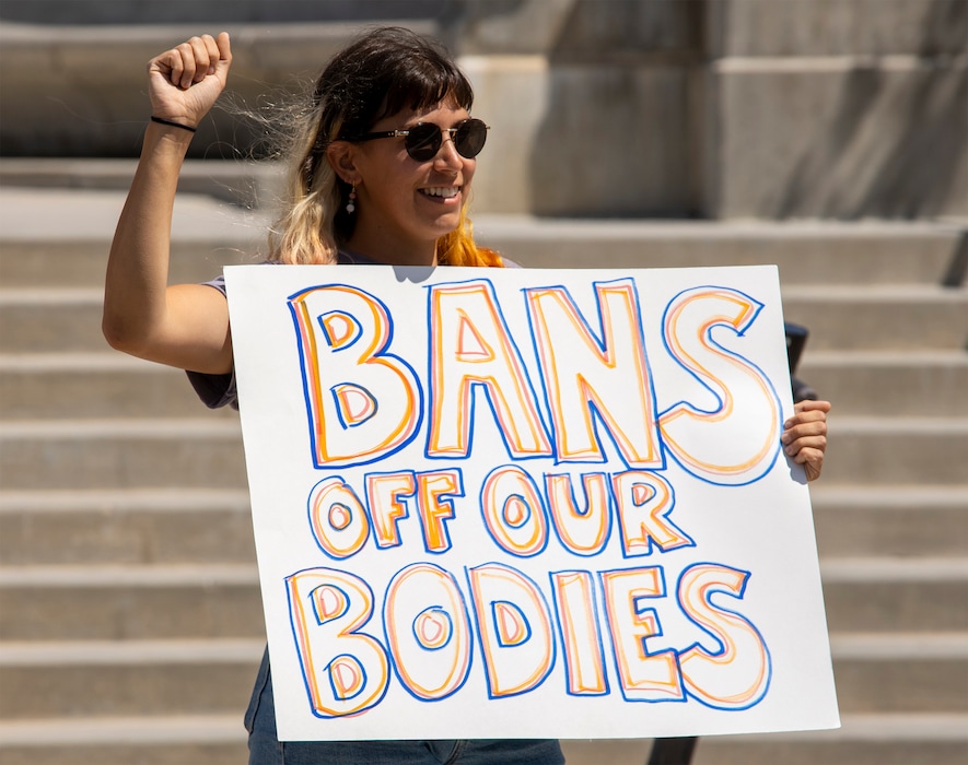 (Rick Egan | The Salt Lake Tribune)  Maria Rado holds a sign as protesters gather at the State Capitol, after the Supreme Court overturned Roe v. Wade, on Friday, June 24, 2022.
