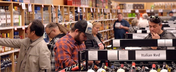 (Al Hartmann  |  The Salt Lake Tribune) 	Shoppers fill the ailes at the Cottonwood Heights state liquor store Wednesday Nov. 22.  The Wednesday before Thanksgiving is typically one of the busiest days for liquor sales in Utah. Customers typically line up outside before the 11 a.m. opening.   Extra employees work to handle the holiday rush. 