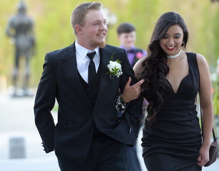 (Leah Hogsten  |  The Salt Lake Tribune) Utah Connections Academy student Alexxis Bonacci and her date Travis Stewart enter the dance.Three virtual charterÊschools, Utah Virtual Academy, Utah Connections Academy and Mountain Heights Academy, co-hosted prom for their students, Friday, April 27, 2018. 