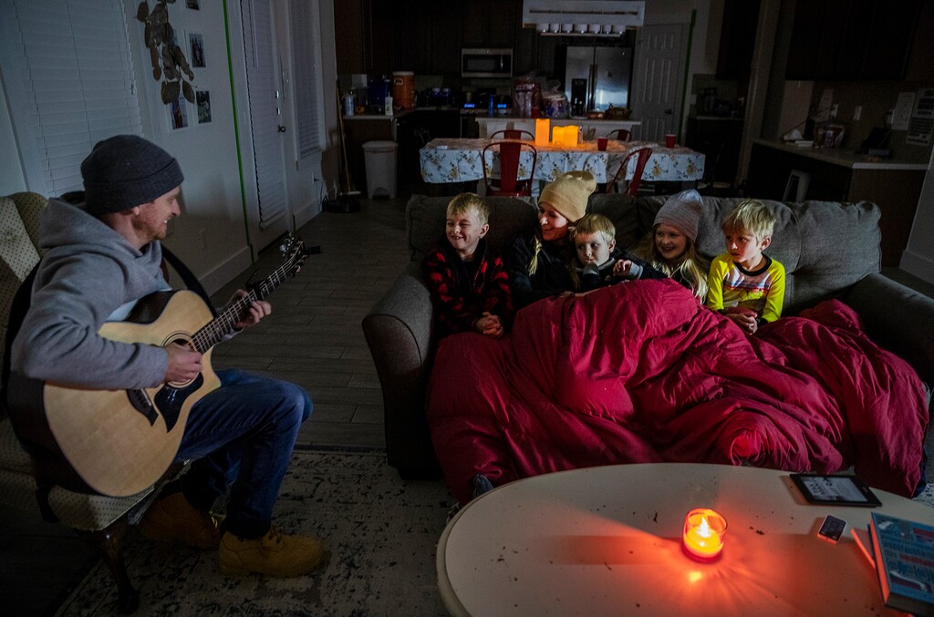 (Ricardo B. Brazziell | Austin American-Statesman via AP)
Brett Archibald tries to entertain his family as they attempt to stay warm in their home the BlackHawk neighborhood in Pflugerville, Texas, Tuesday, Feb 16, 2021. Anger over Texas’ power grid failing in the face of a record winter freeze mounted Tuesday as millions of residents in the energy capital of the U.S. remained shivering with no assurances that their electricity and heat — out for 36 hours or longer in many homes — would return soon or stay on once it finally does.