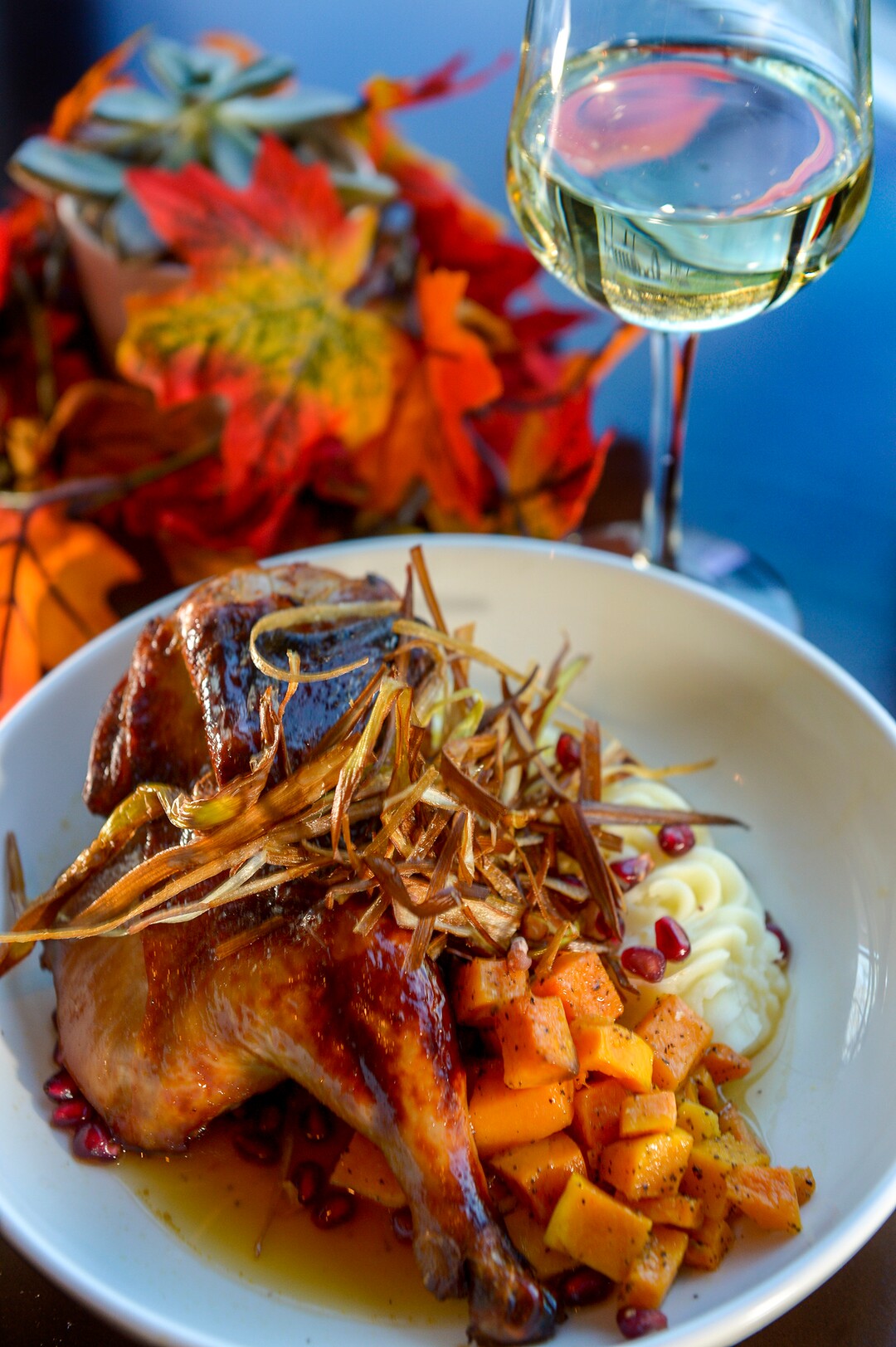 Leah Hogsten  |  The Salt Lake Tribune   Maple-brined chicken, bourbon butternut squash, buttermilk mash potatoes, garnished with pomegranates and fried leeks at Thistle & Thyme restaurant, inside Salt Lake City's Marriott University Park Hotel.
