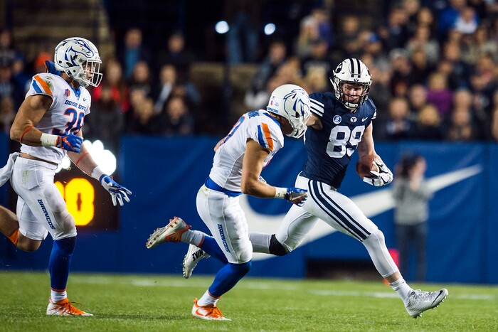 (Chris Detrick  |  The Salt Lake Tribune)  Brigham Young Cougars tight end Matt Bushman (89) runs past Boise State Broncos safety Kekoa Nawahine (10) during the game LaVell Edwards Stadium Friday, October 6, 2017. 
