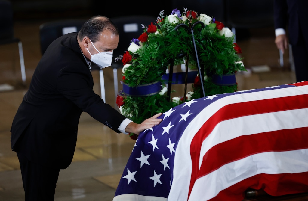 (Chip Somodevilla | Pool) 

Sen. Mike Lee, R-Utah, touches the casket after a memorial service for former Senate Majority Leader Harry Reid, D-Nev., in the Rotunda of the U.S. Capitol as Reid lies in state, Jan. 12, in Washington.